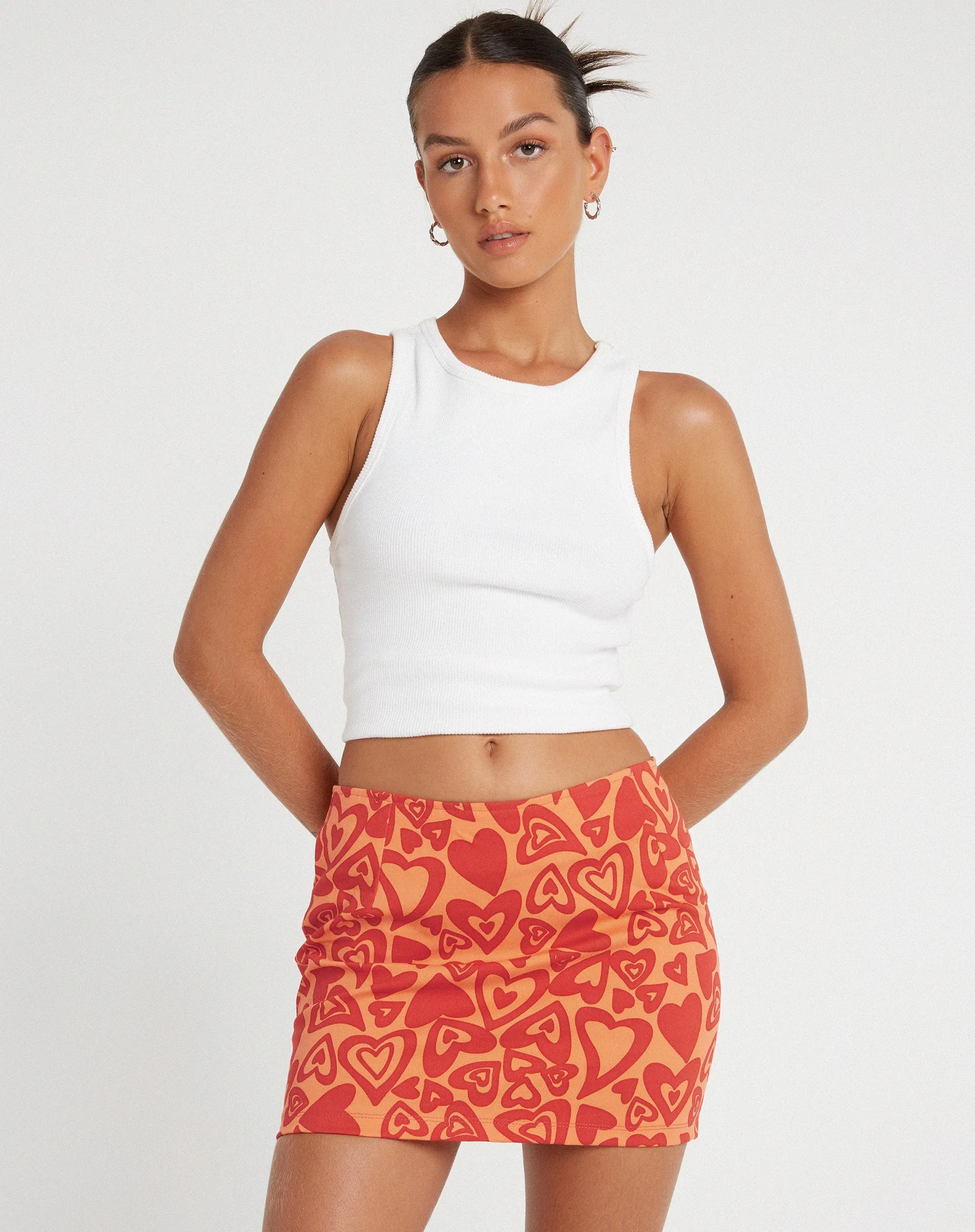 Ima Mini Skirt in Retro Heart Orange sold by Motel Rocks