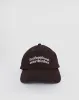 Cap in Bitter Chocolate with Professional Overthinker Slogan sold by Motel Rocks