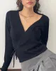Zelda Knitted Wrap Cardigan in Black with Rosette sold by Motel Rocks