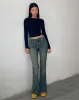 Low Rise Flared Jeans in Green Wash sold by Motel Rocks