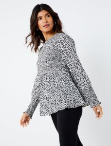 Smocked Peplum Long Sleeve Maternity Top sold by Motherhood Maternity