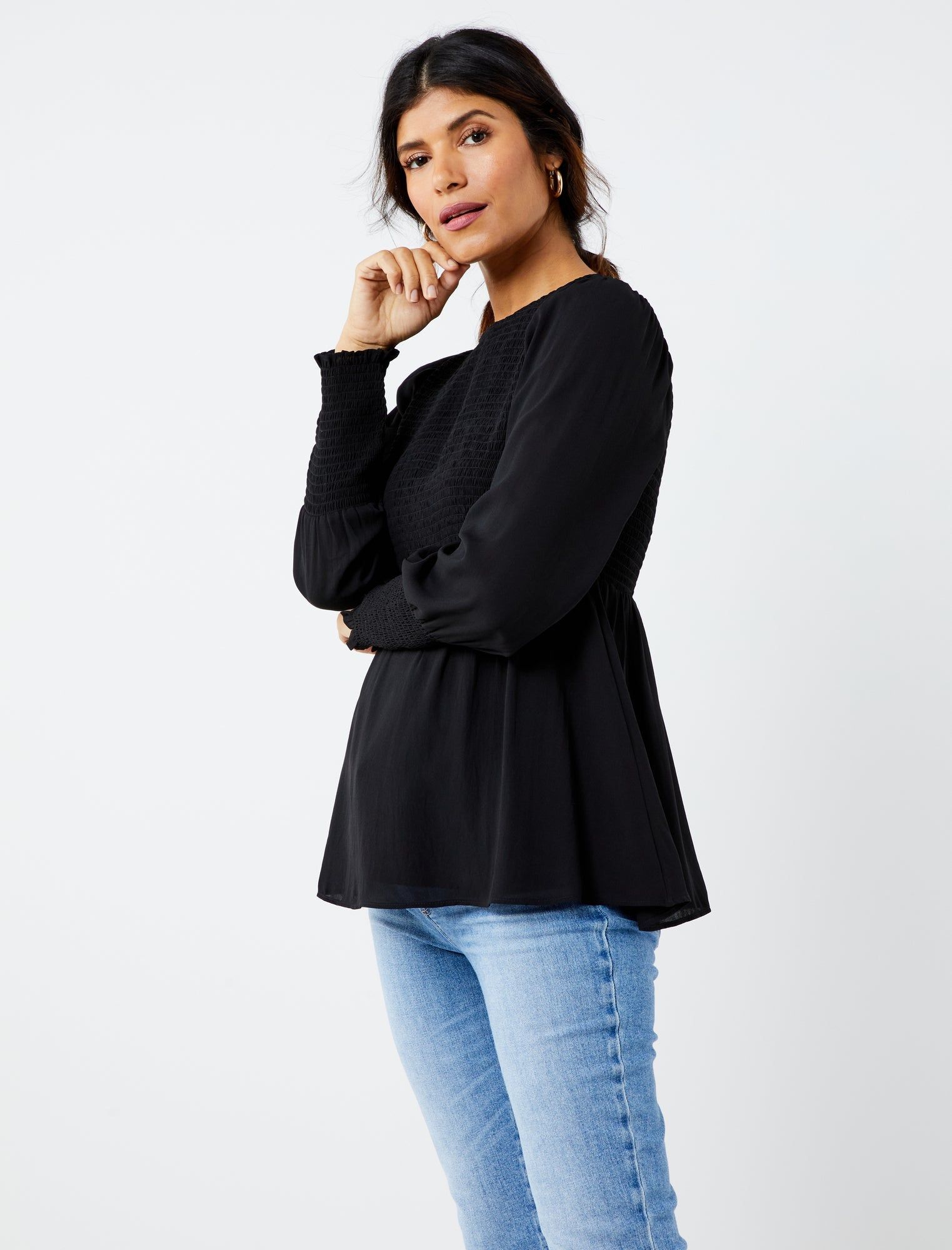 Smocked Peplum Long Sleeve Maternity Top sold by Motherhood Maternity