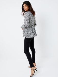 Smocked Peplum Long Sleeve Maternity Top sold by Motherhood Maternity