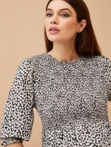 Smocked Peplum Long Sleeve Maternity Top sold by Motherhood Maternity