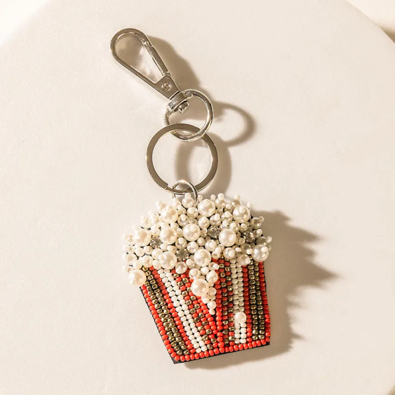 Lights, Camera, Pop! Keychain in Cherry Shine sold by Myra Bag