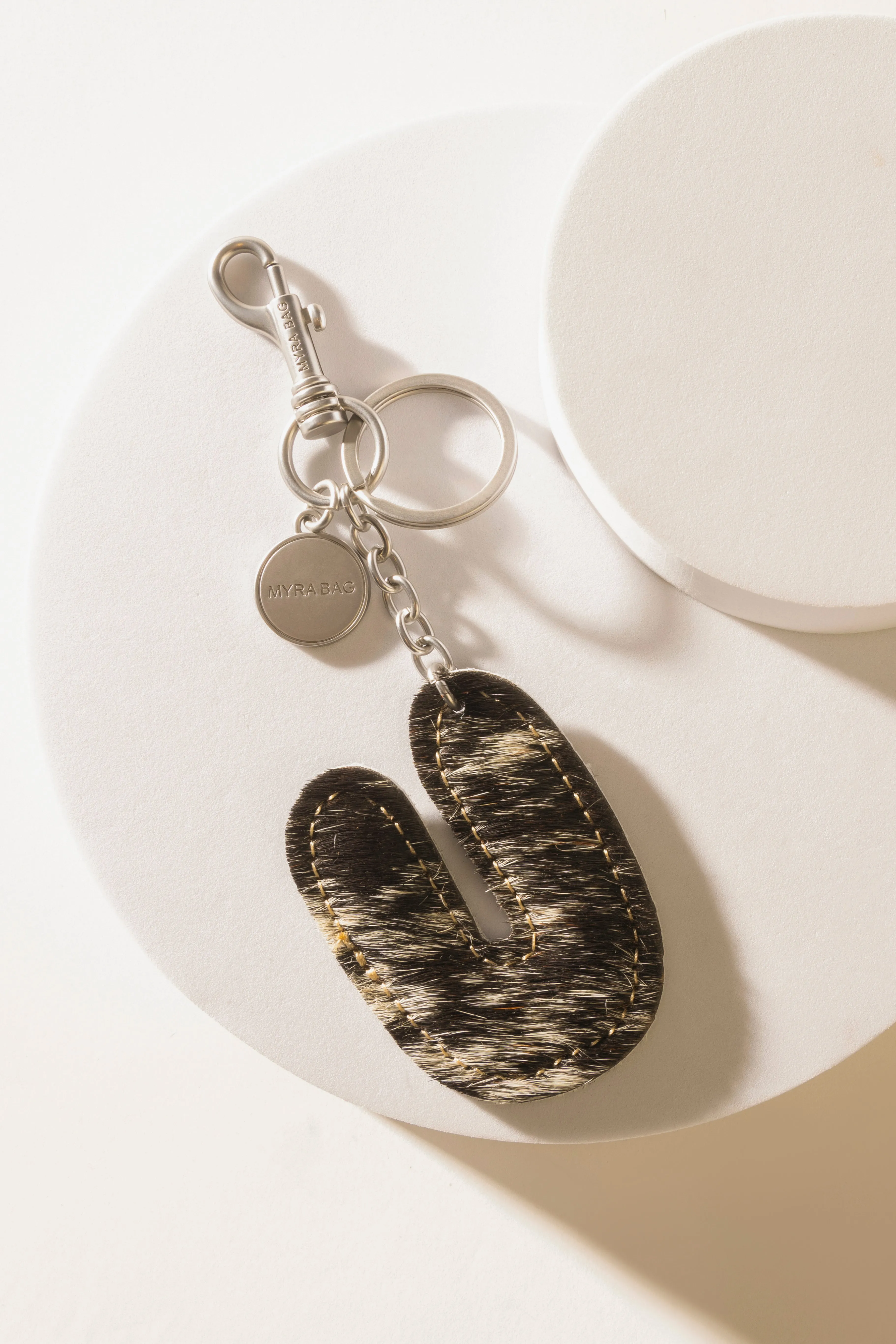 Alpha 'U' Hairon Bag Charm in Vanilla Dust sold by Myra Bag