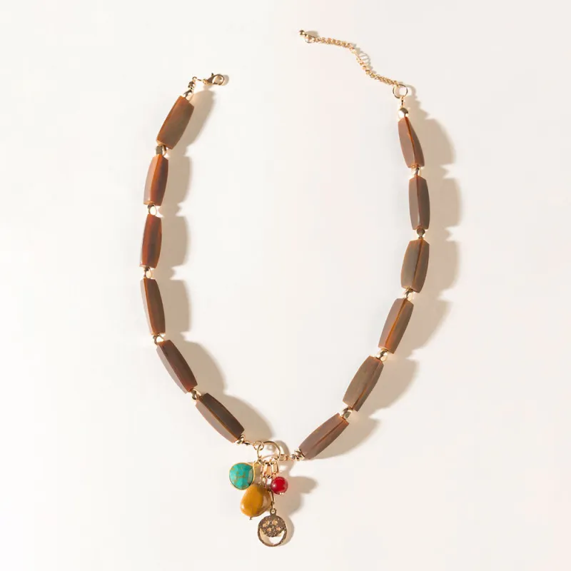 The Elowen Necklace in Cedar Brown sold by Myra Bag