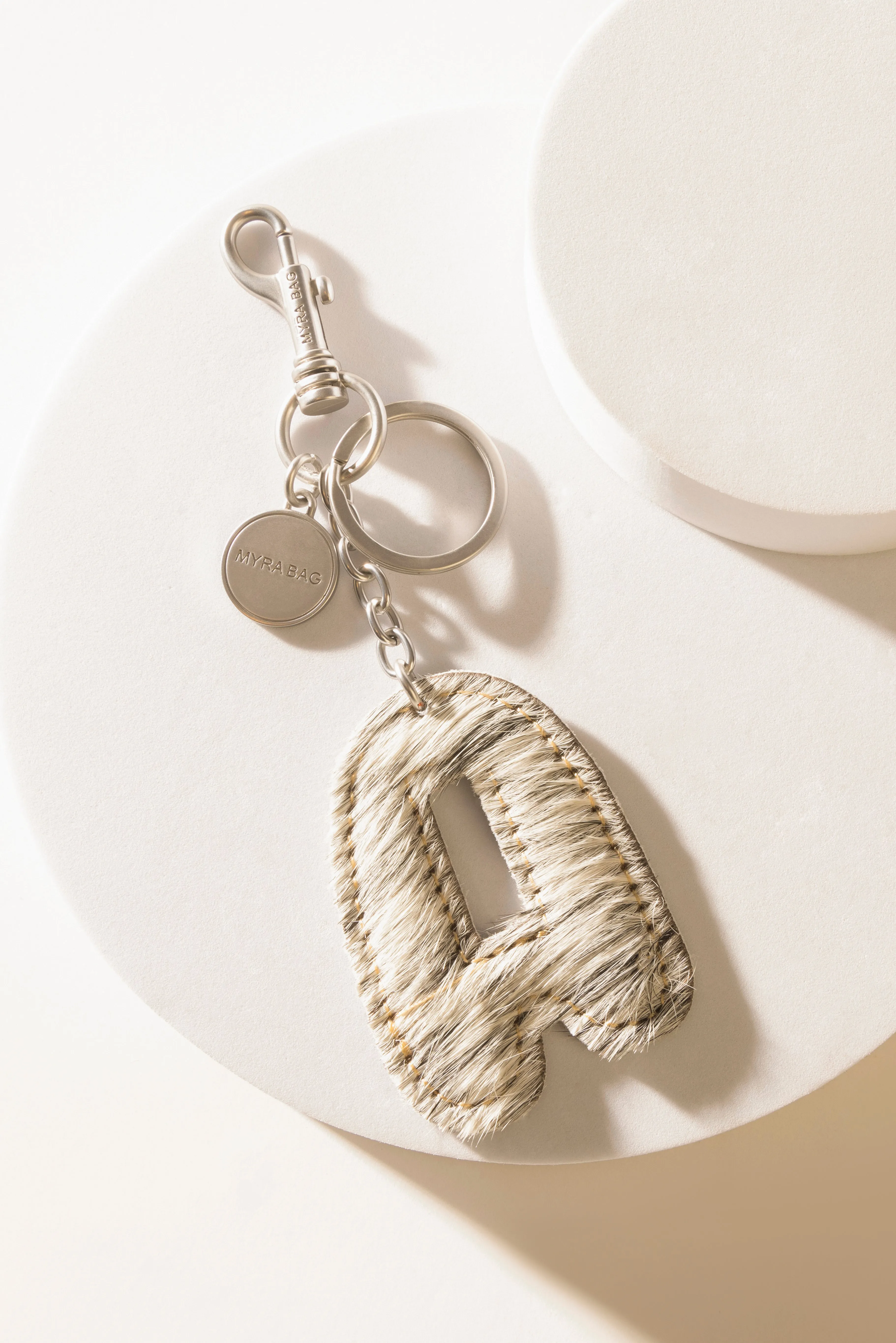 Alpha Hairon Bag Charm in Black & White sold by Myra Bag