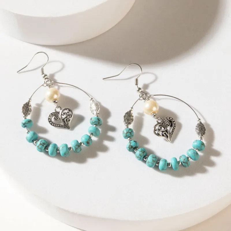 Wild Bloom Heart Earrings in Ranch Teal sold by Myra Bag