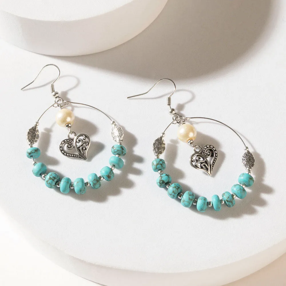 Wild Bloom Heart Earrings in Ranch Teal sold by Myra Bag