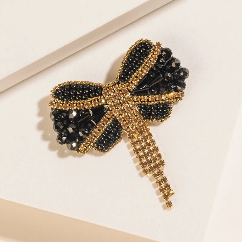 Evening Grace Bow Brooch in Gilded Gold made by Myra Bag