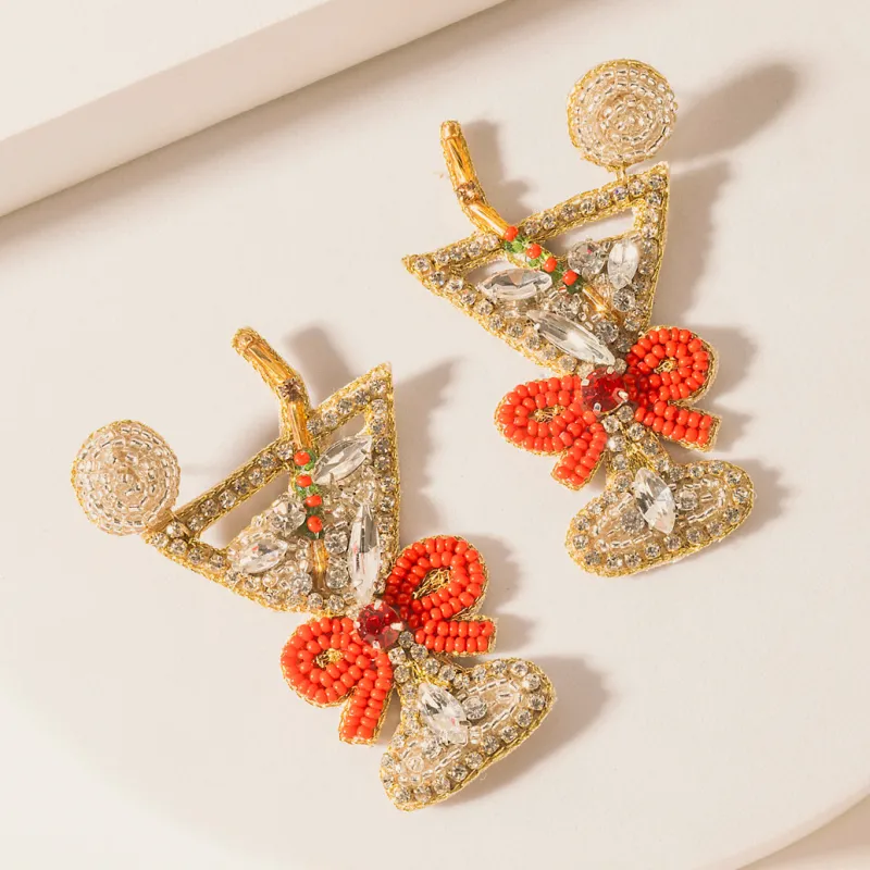 Enchanted Eve Charm Earrings in Crimson Glow sold by Myra Bag