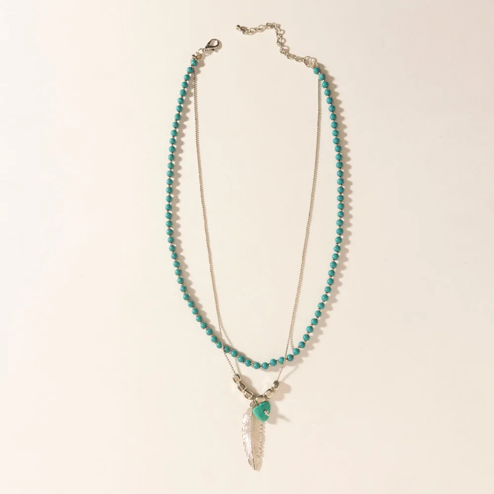 Feathered Sage Necklace in Range Blue sold by Myra Bag