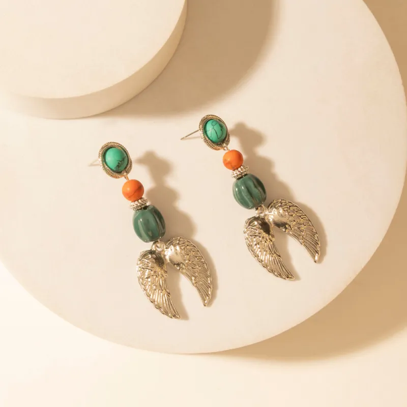 Guardian Wing Dangle Earrings in Sterling Silver sold by Myra Bag