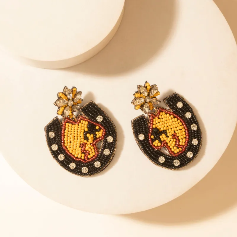 Mascot Charm Earrings in Ember Spark sold by Myra Bag