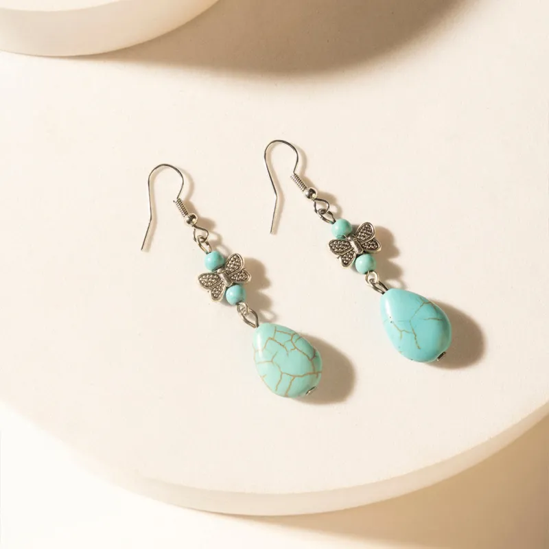 Guardian Spirits Drop Earrings in Soft Teal sold by Myra Bag