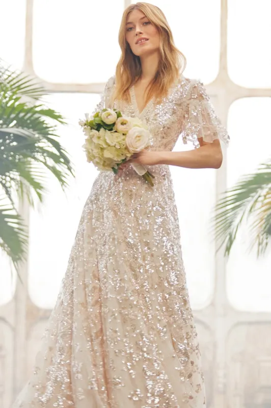 Trailing Bow Gown sold by Needle & Thread