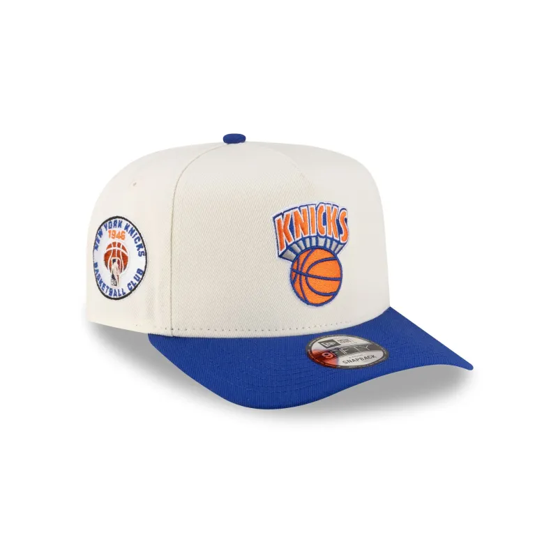 New York Knicks 1964-1992 Hardwood Classics Express Chrome White 9FIFTY A-Frame Snapback Hat sold by New Era