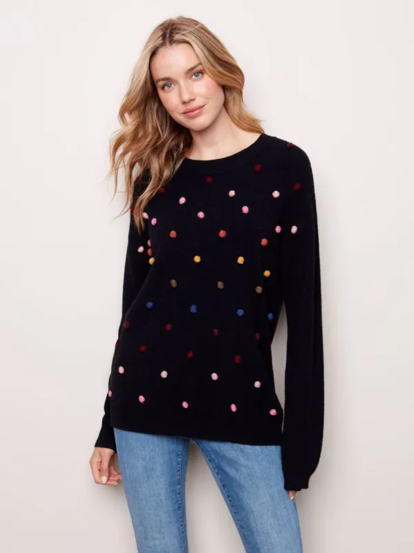 SWEATER WITH POM POMS sold by Nica