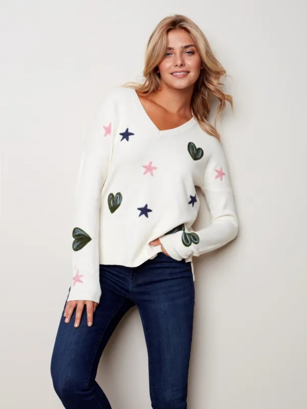 HEARTS AND STARS V-NECK SWEATER sold by Nica