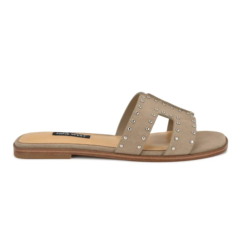 Giny Slip-On Flat Studded Sandals sold by Nine West