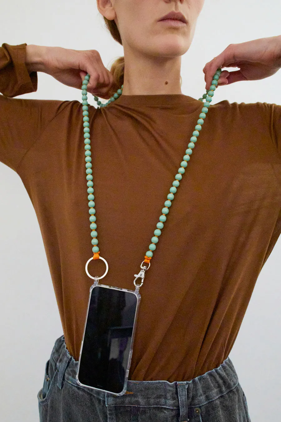 Ina Seifart Handykette Iphone Necklace in Pastel Green with Orange Thread sold by No. 6