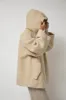 Anggae Fuzzy Hood Outer in Ivory sold by No. 6