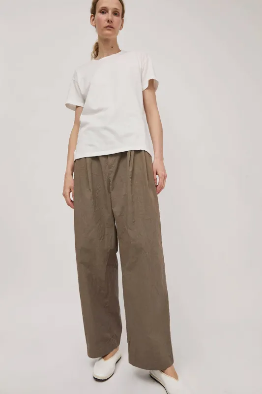 Black Crane Crinkled Wide Trousers in Mud sold by No. 6