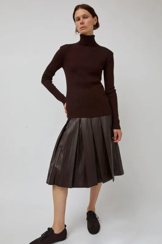 TONYWACK Faux Leather Pleated Midi Skirt in Brown sold by No. 6