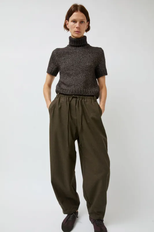 UMARMUNG Wool Flannel Oval Silhouette Pants in Dark Olive sold by No. 6