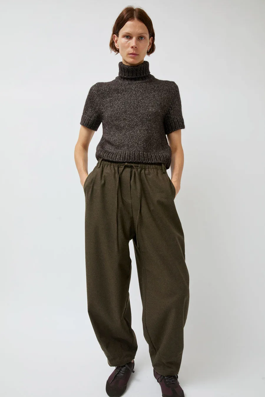 UMARMUNG Wool Flannel Oval Silhouette Pants in Dark Olive sold by No. 6