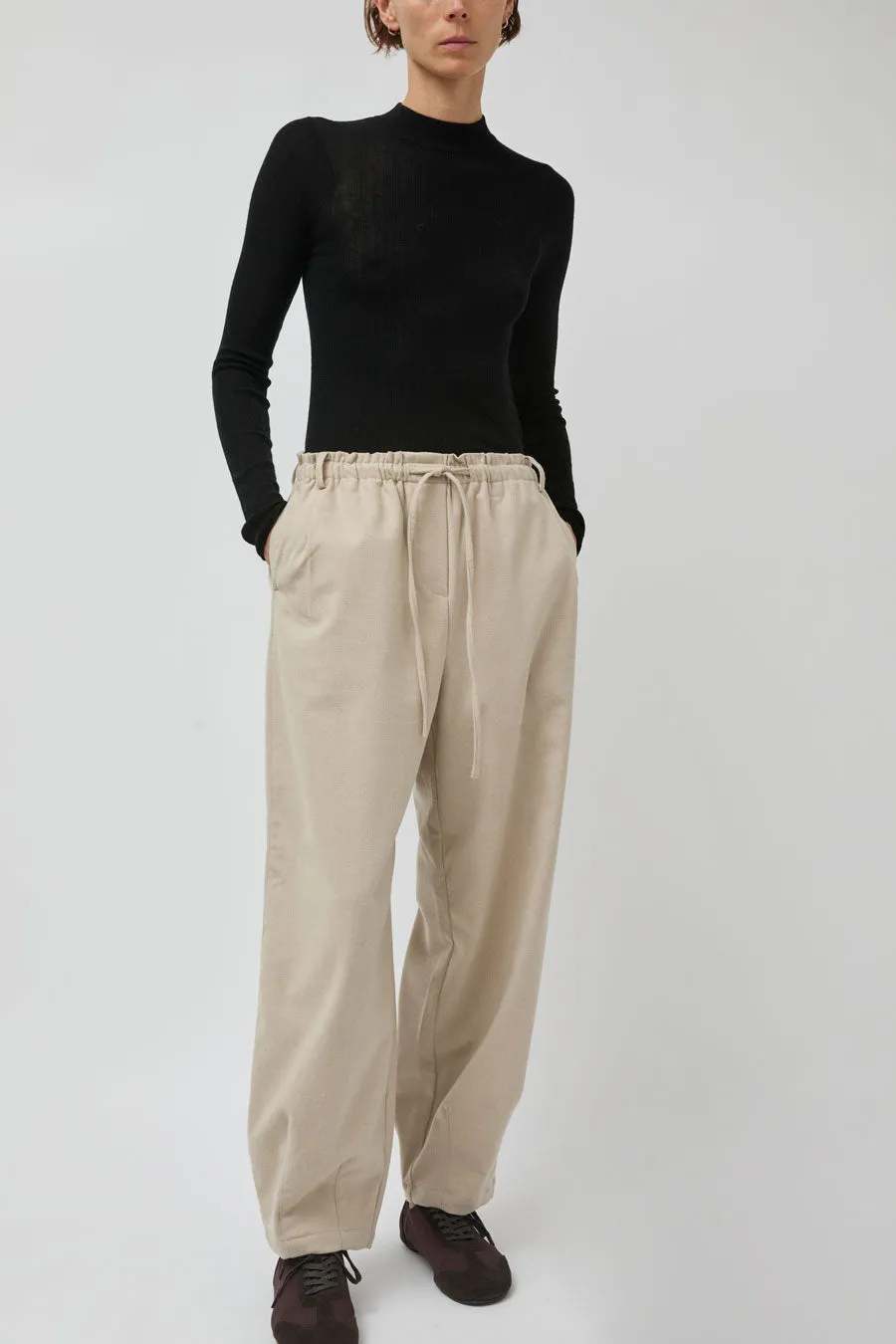 UMARMUNG Wool Flannel Oval Silhouette Pants in Cream sold by No. 6