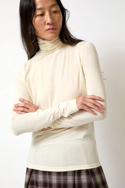 Mijeong Park Roll Neck Jersey Top in Ivory made by Mijeong Park