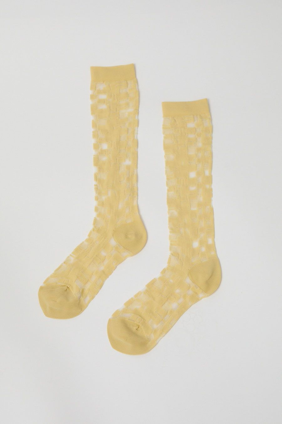 Henrik Vibskov Unboxing Socks Femme in Transparent Yellow sold by No. 6