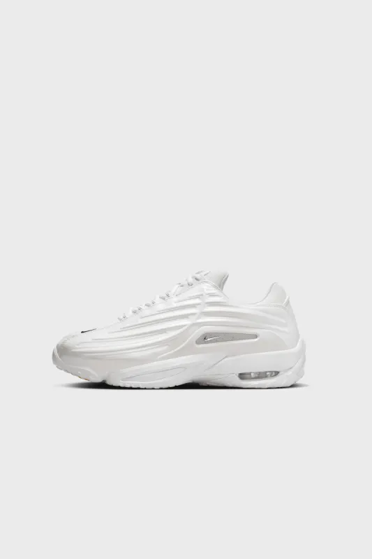 NOCTA Hot Step II White/Chrome-University Gold DZ7293-100 sold by Nomad