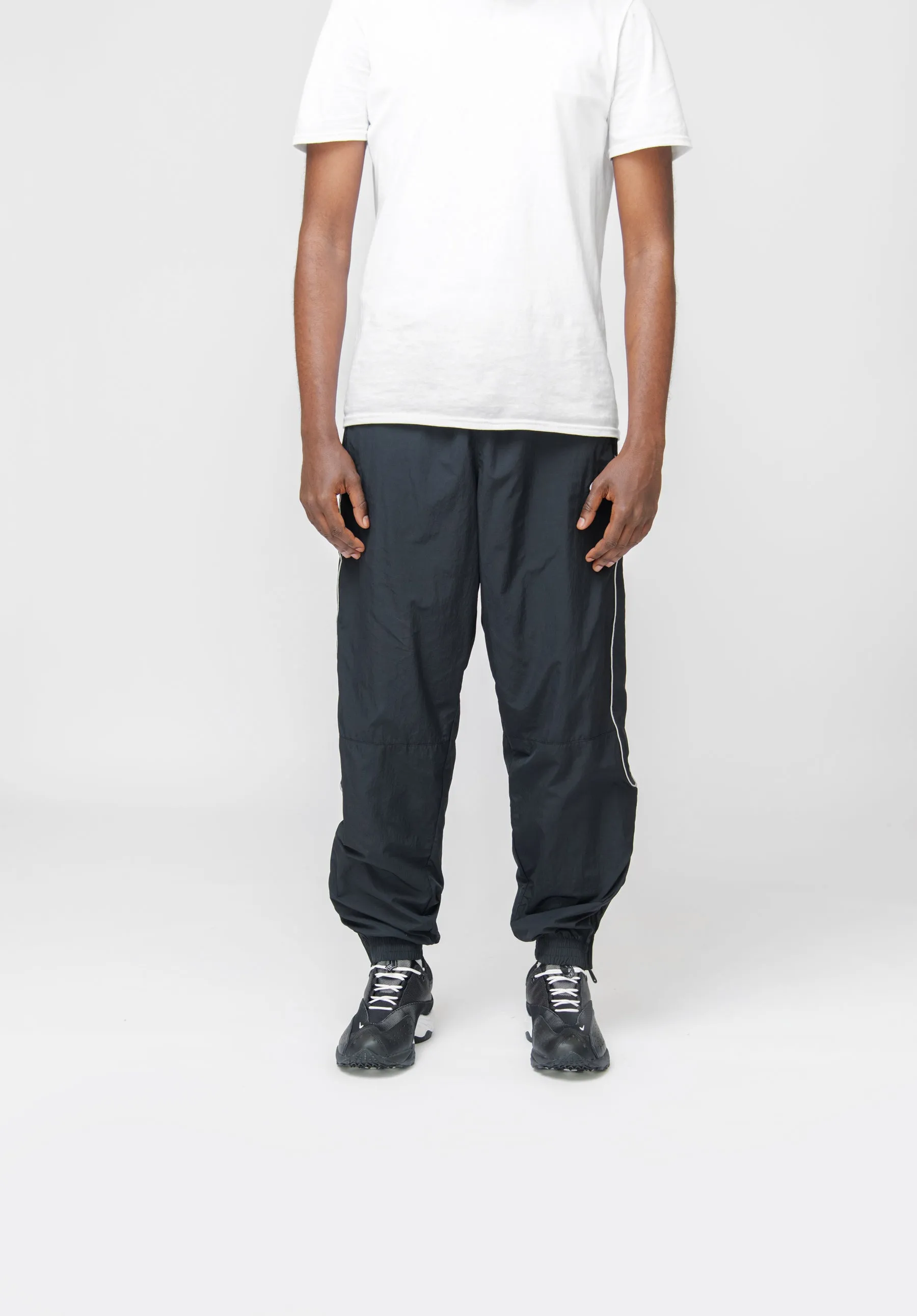 Nike Solo Swoosh Pants Black/White FB8620-010 sold by Nomad