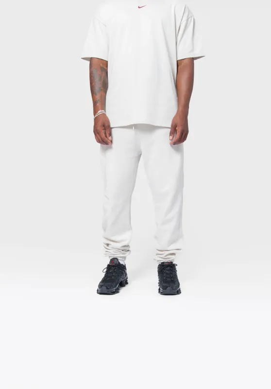 NOCTA CS Sweatpant LT Orewood Brown HM5764-104 sold by Nomad