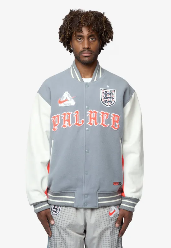 Men's Nike x Palace Varsity Jacket Grey/Neon Orange/White IM6636-065 made by Nike