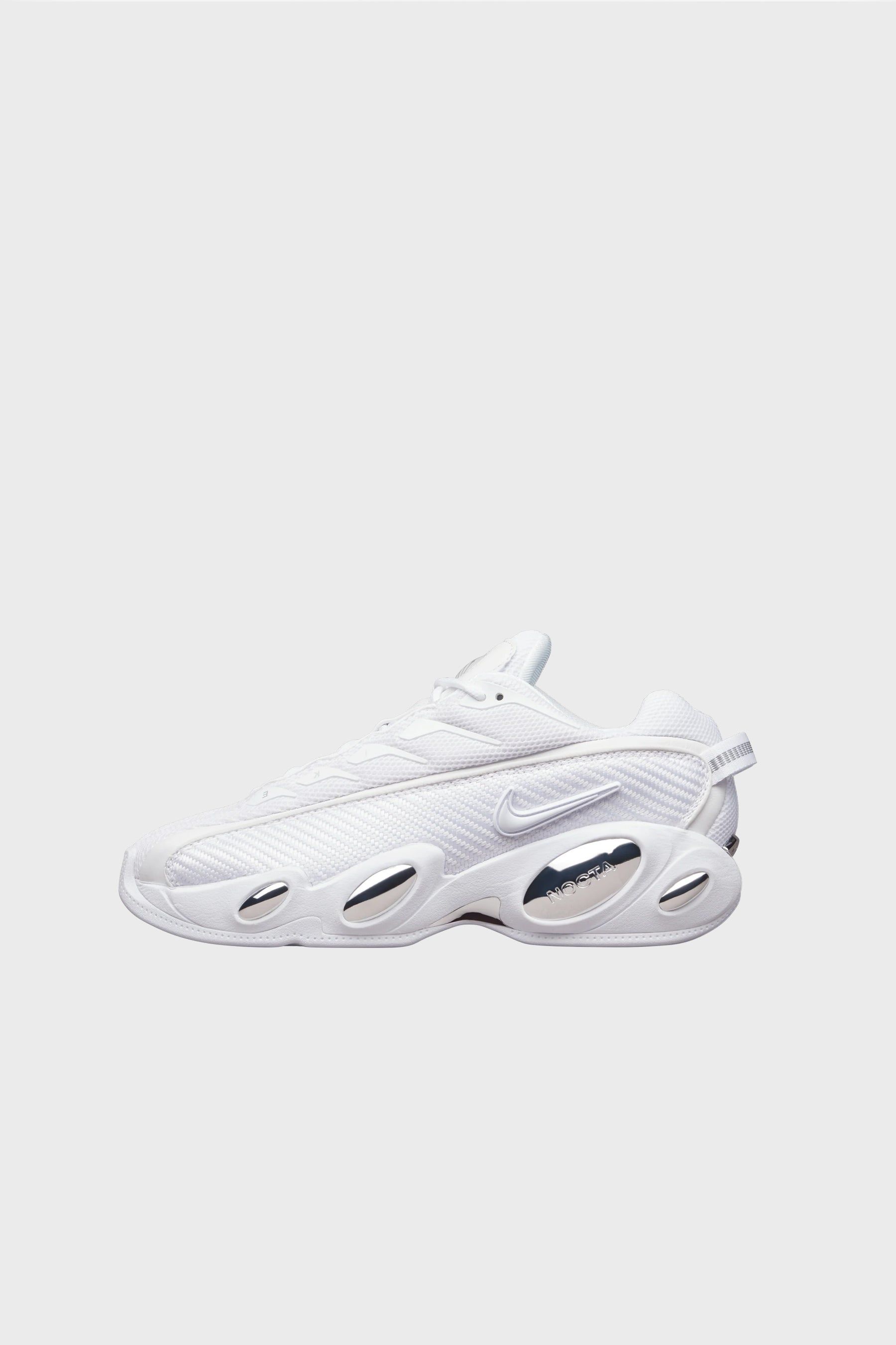 NOCTA Glide White/Chrome/University Gold DM0879-100 sold by Nomad