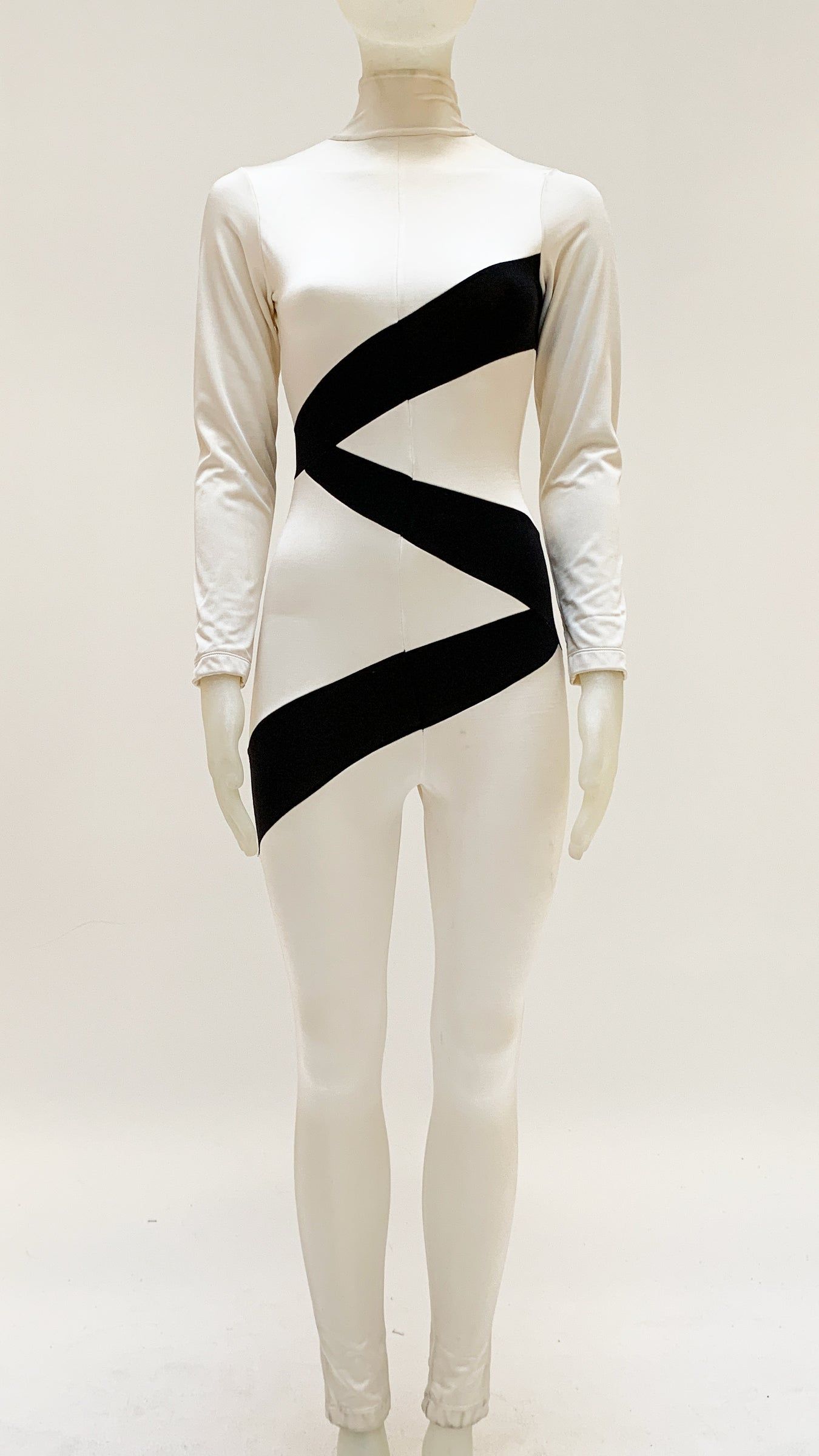 SPLICED LONG SLEEVE TURTLENECK JUMPSUIT sold by Norma Kamali