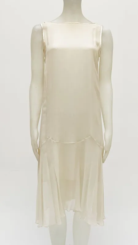 SLEEVELESS TIE FRONT BABYDOLL DRESS sold by Norma Kamali