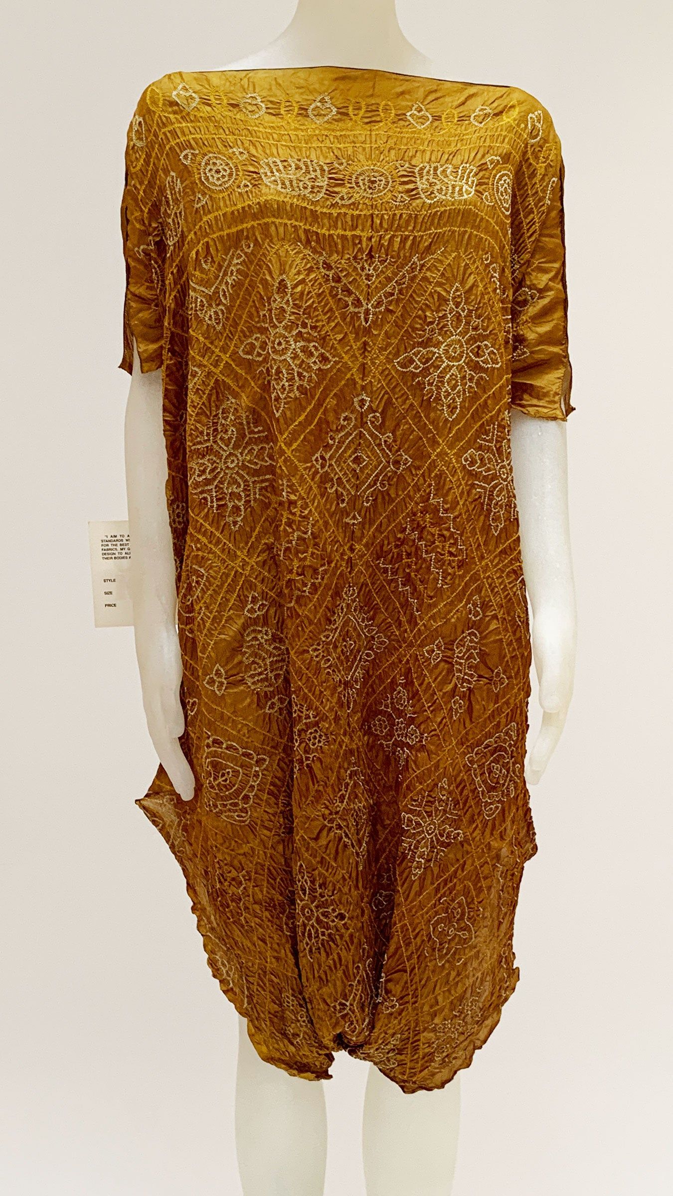 SHORT SLEEVE EMBROIDERED TUNIC sold by Norma Kamali