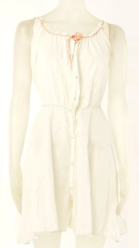 TANK JUMPSUIT WITH PINK VELVET NECK TIE sold by Norma Kamali