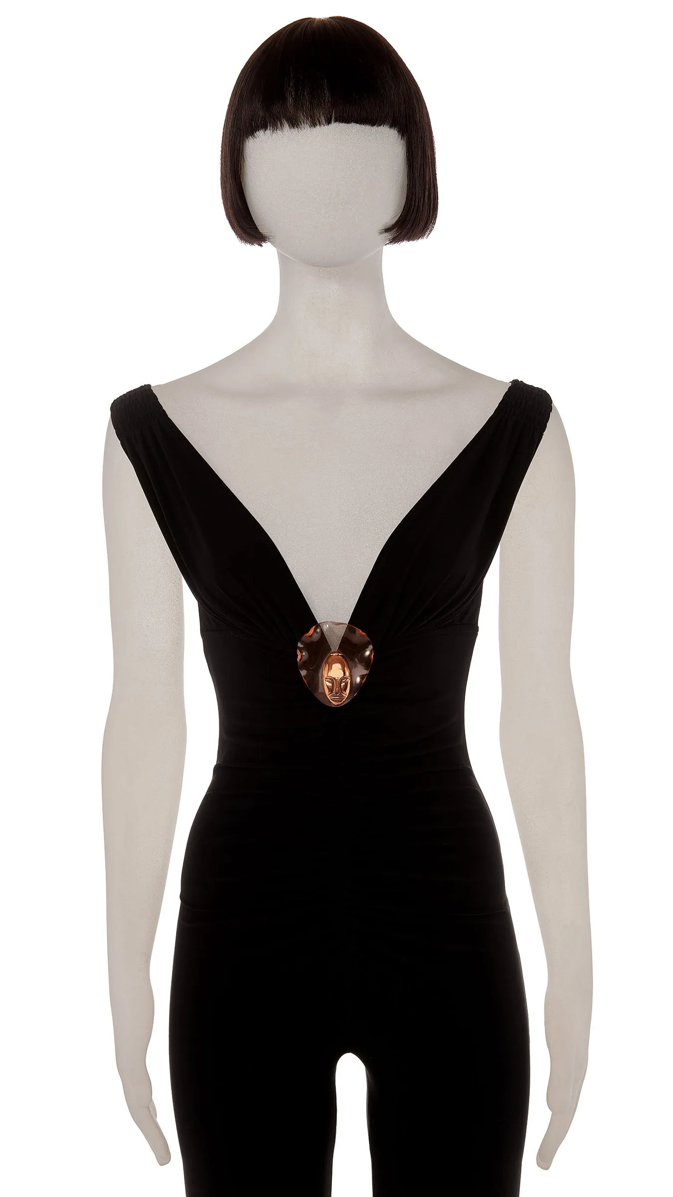 BRASS FACE ON LUCITE BROOCH sold by Norma Kamali