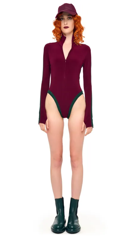 SIDE STRIPE ZIP FRONT L/S TURTLENECK BODYSUIT sold by Norma Kamali