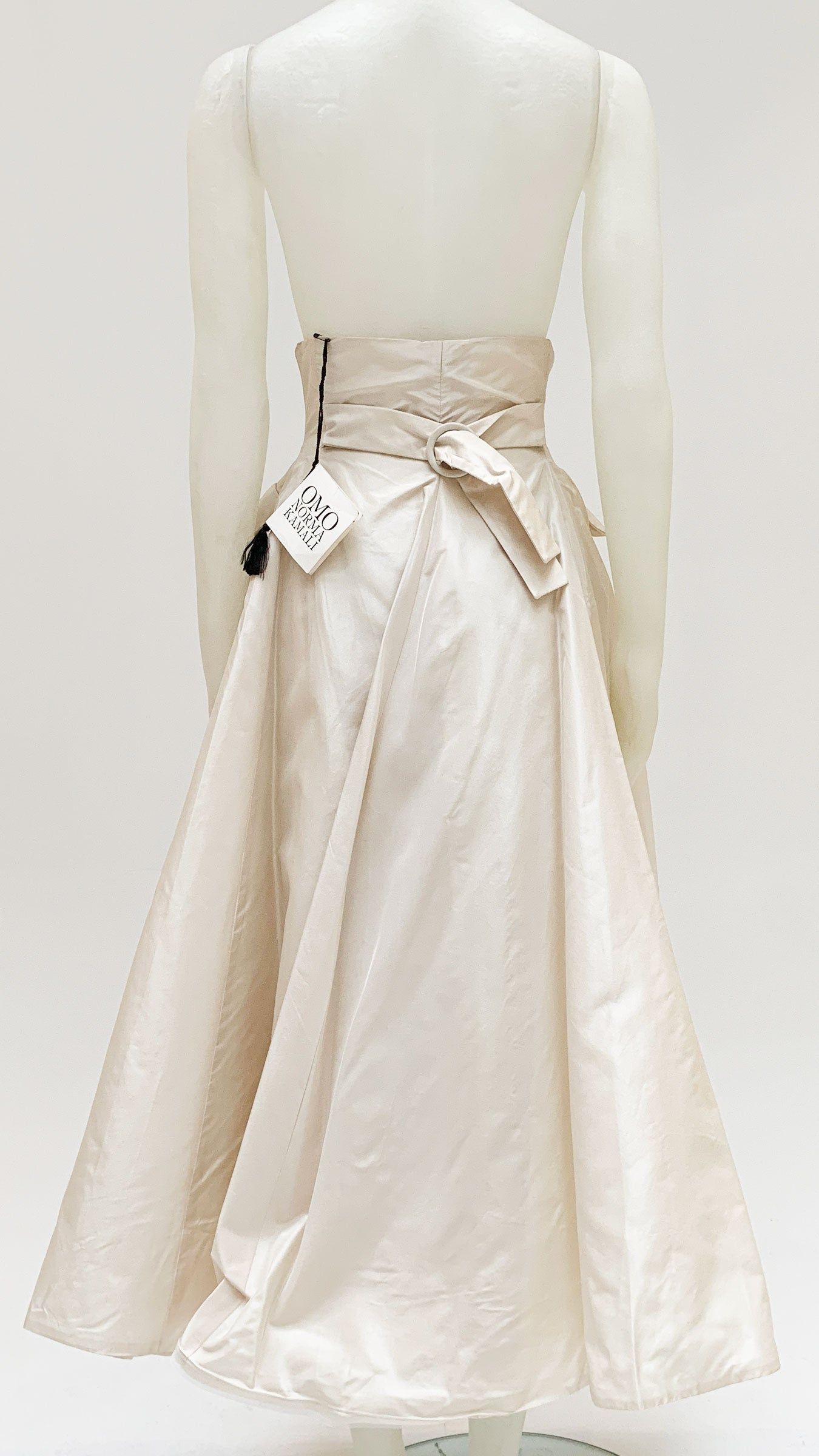 PLEATED FLARED BUTTON SKIRT sold by Norma Kamali