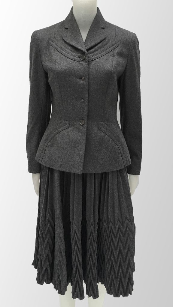 OVERLAY DETAIL JACKET W/ COMBO ACCORDION PLEAT SKIRT sold by Norma Kamali