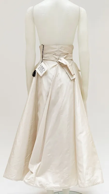 PLEATED FLARED BUTTON SKIRT sold by Norma Kamali