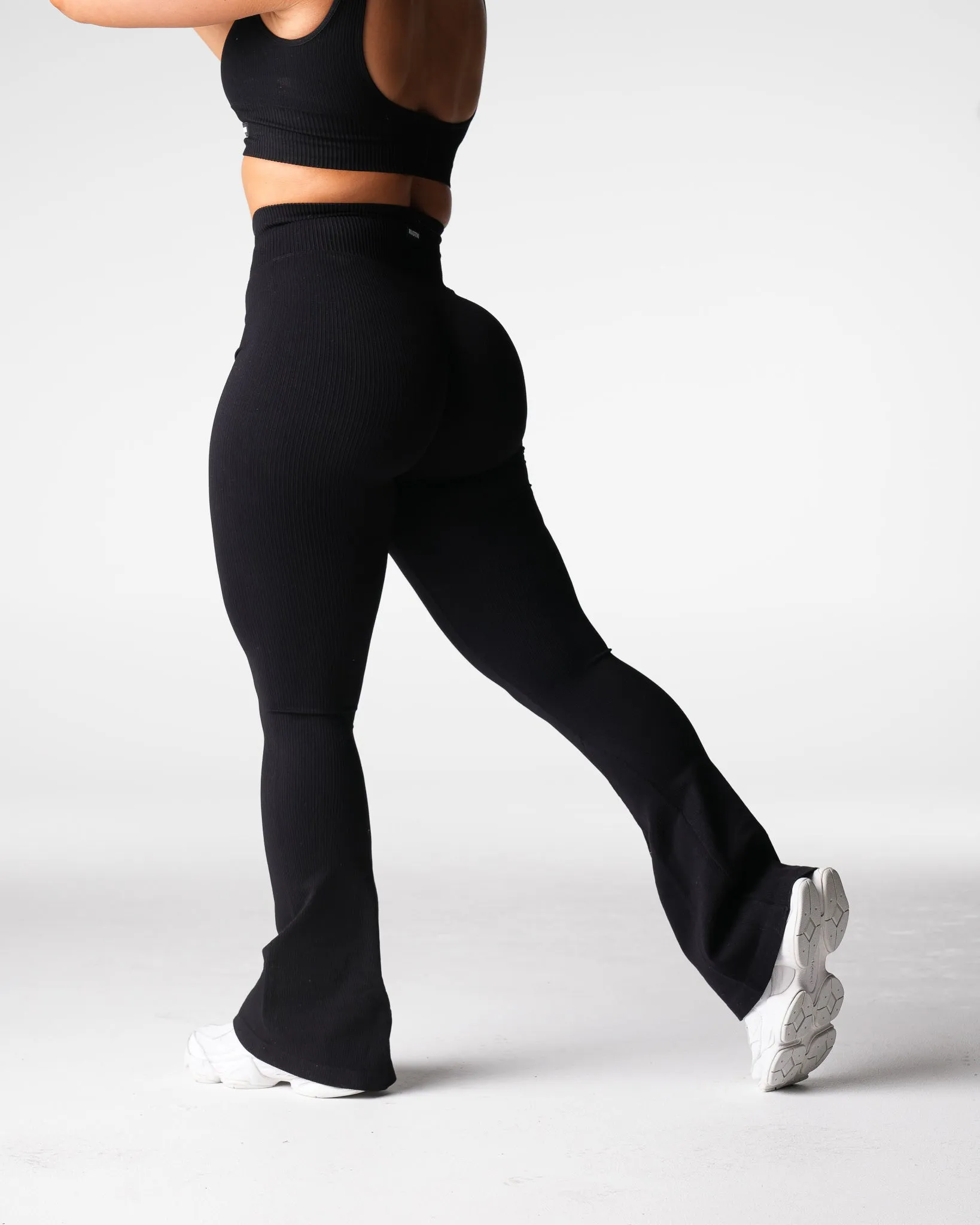 Black Harmony Ribbed Seamless Flare Leggings sold by NVGTN