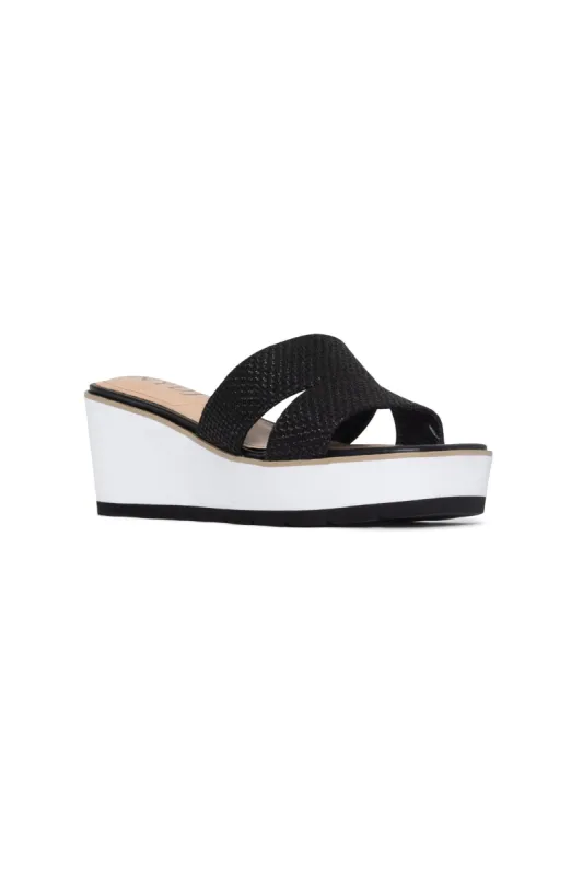 Raizy Wedge Sandals - Black sold by NYDJ